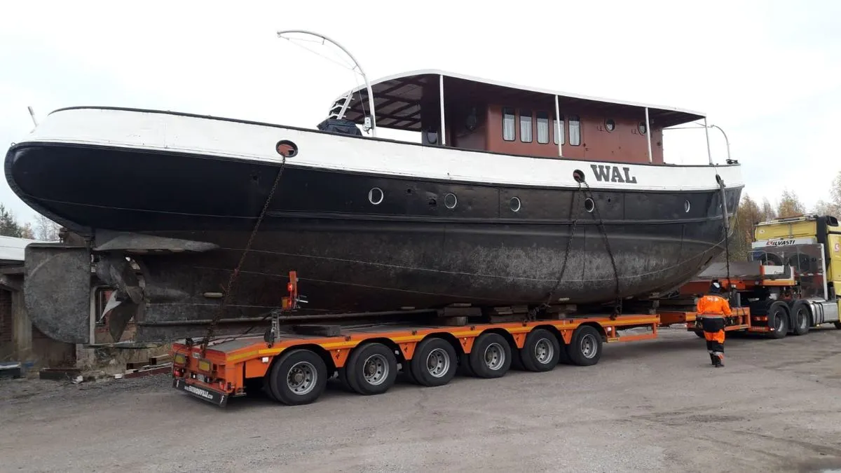 Vessel loaded on a low-loader trailer at Olkkola shipyard