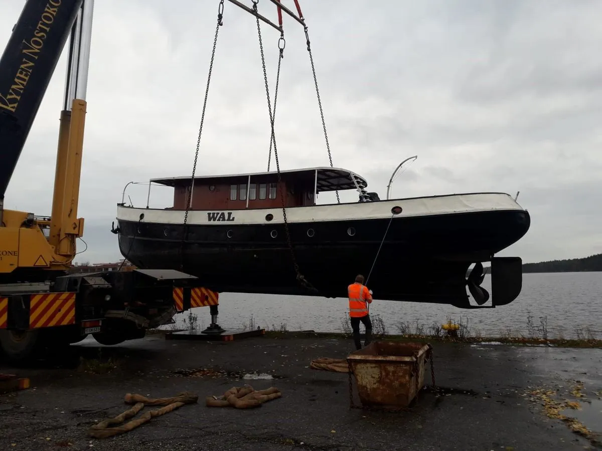 Vessel lifted by cranes at the launch site